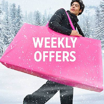 A man holding a pink bag.