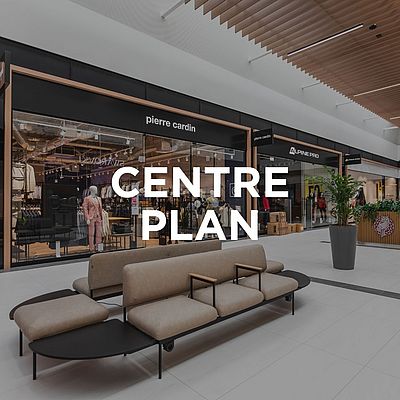 Interior of Designer Outlet Kraków with the Greenpoint store window and the text "Centre plan" in the center of the image.