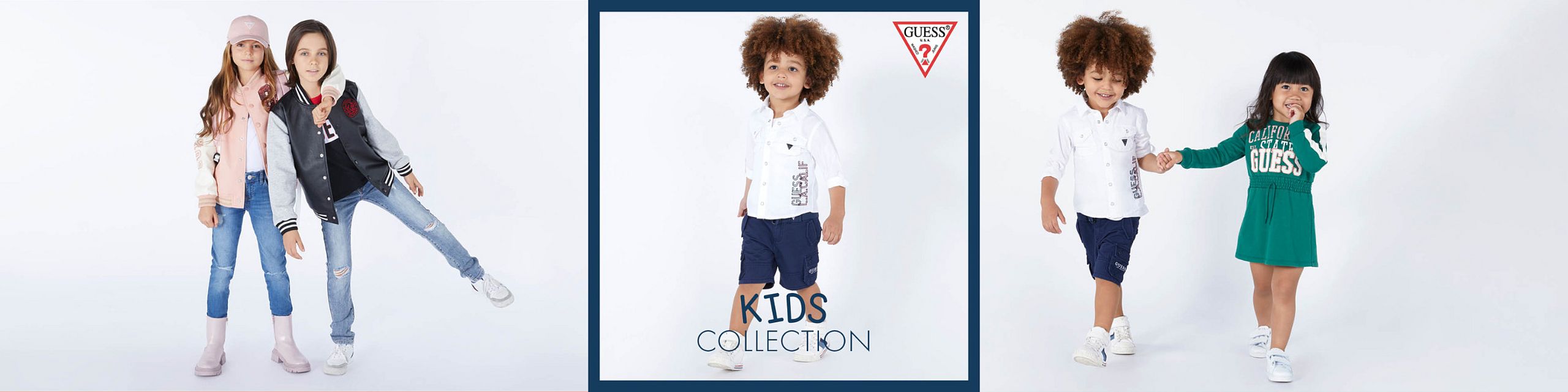 Against a white background, children wearing trendy GUESS outfits. On the left, two girls in jeans and jackets. In the center, a boy in a white T-shirt and navy shorts is framed by the GUESS logo. On the right, a boy and girl hold hands — he wears a T-shirt and shorts, she a green dress.