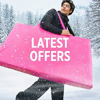 A man holding a pink bag.