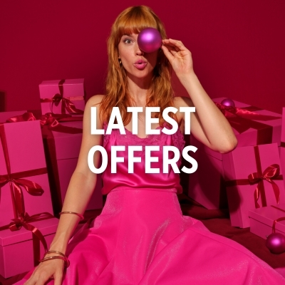 A woman in a pink dress holding a purple bauble, with gifts in the background. Text on the image: 'LATEST PROMOTIONS'