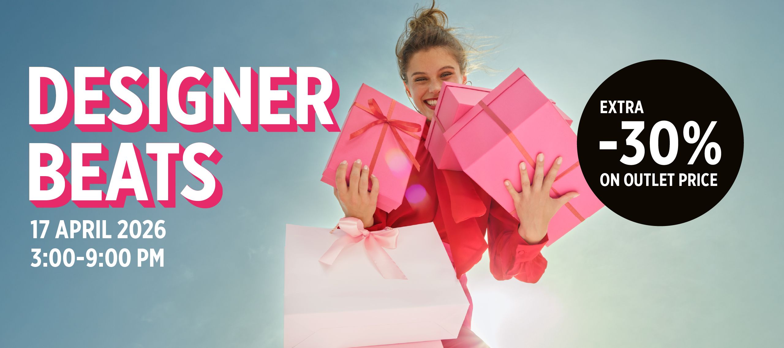 Smiling woman holding pink gifts against the sky.