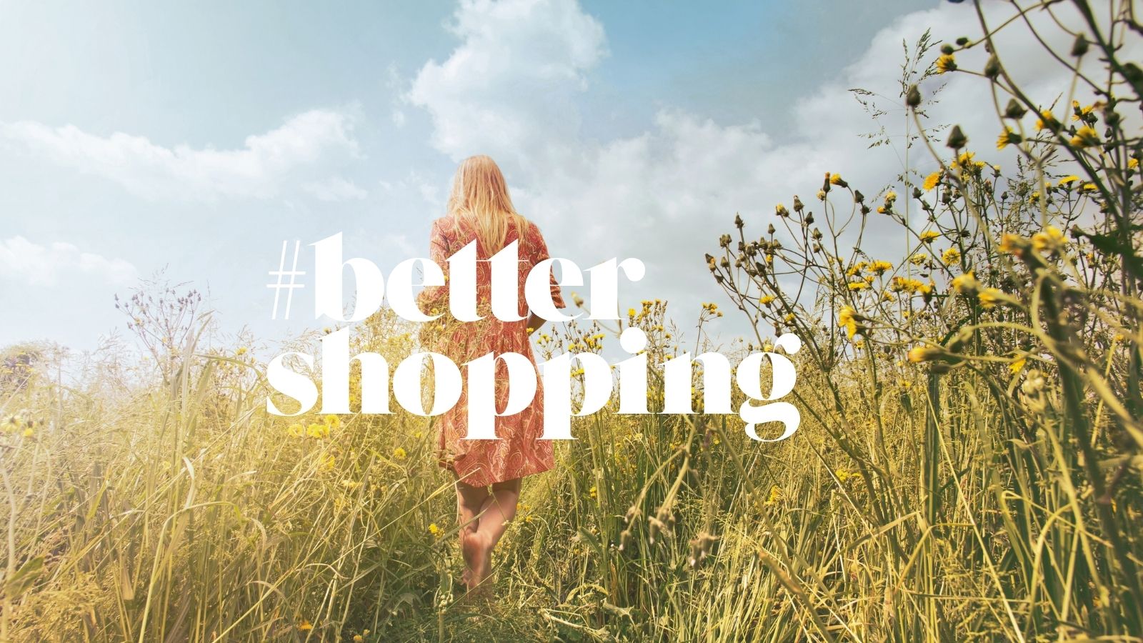 Woman standing with her back in a field of yellow flowers under a blue sky, with the text: “#bettershopping – do better every day” in the center.